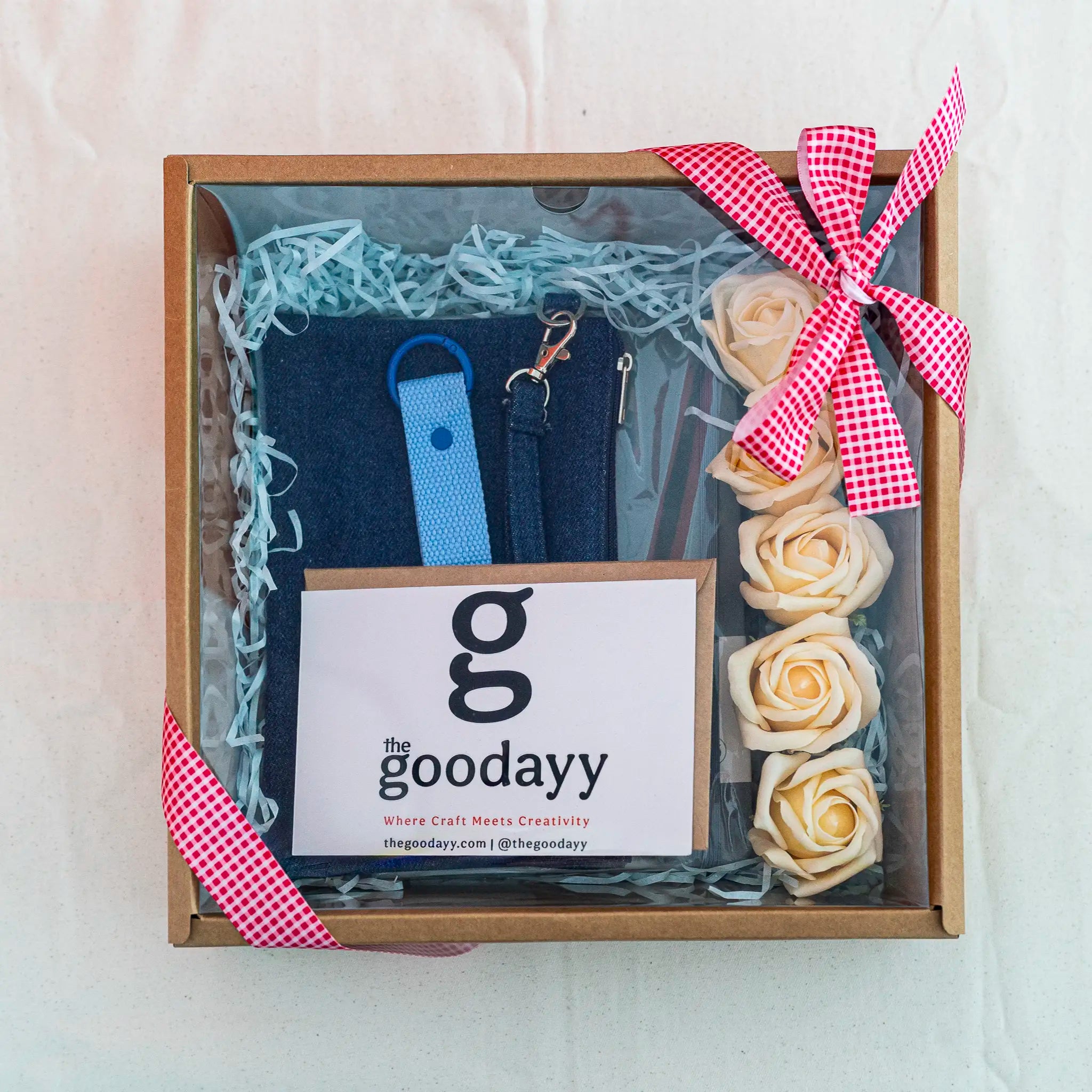 Custom printed blue gift box set including a denim pouch, personalized A5 notebook, and name-printed keychain strap from The Fivefold Affection collection, presented in a kraft window box.