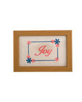 Medium-toned wood frame with pink script reading "Joy" surrounded by an embroidered blue and pink floral border.