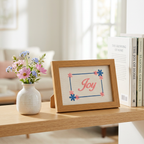 Joy frame on a bright home shelf