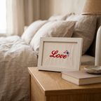 Love in Bloom frame on a bedside table