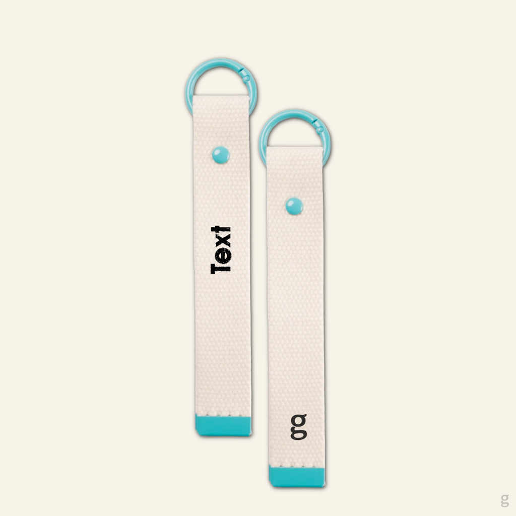 The Goodayy white keychain strap canvas with a baby blue ring clip that can be used a keychain or strap tag accessories. Additionally able to add a personalized embroidered name on.