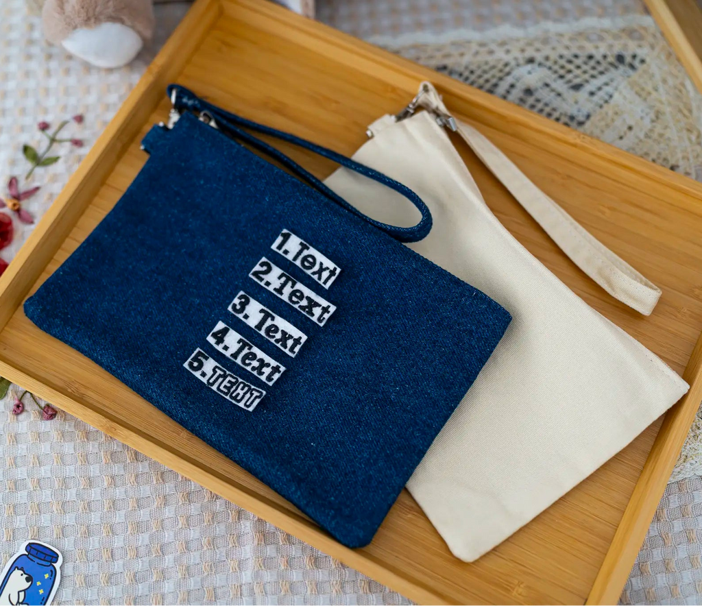 The Goodayy pouches with strap canvas that can personalized with a name or text, one navy and one beige, on a light gray background.