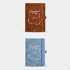 Two notebooks, one brown and one blue, with a decorative bow and personalize 'Name' text on a white background.